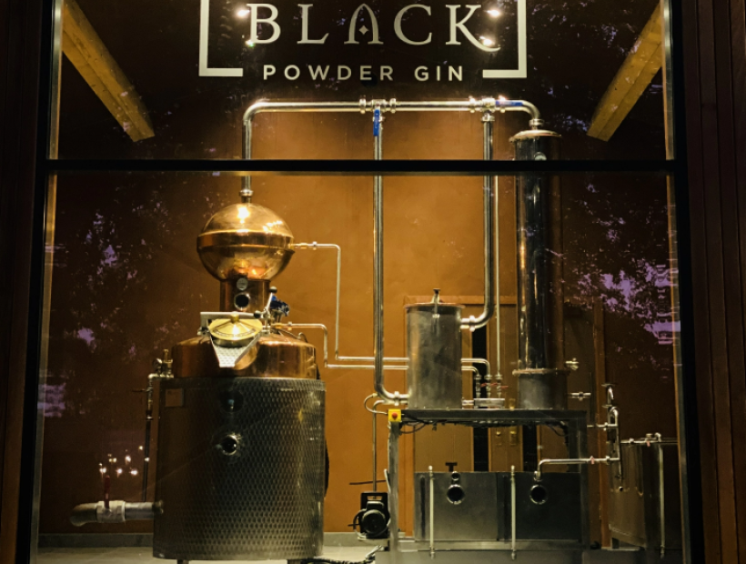 Black powder gin sign and distillery equipment